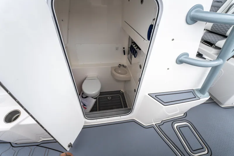  Yacht Photos Pics 2022 Invincible 39 Open Fisherman boat interior with compact bathroom.