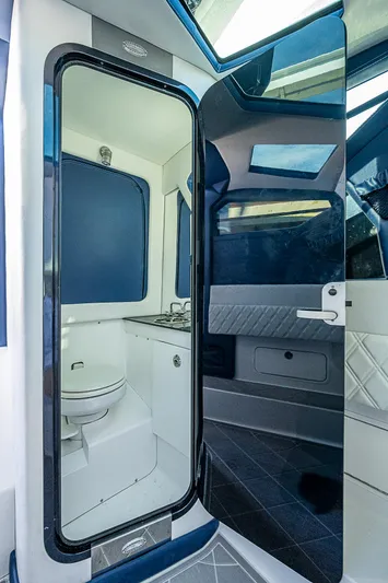  Yacht Photos Pics 2023 Nor-Tech 400 boat interior with modern bathroom and sleek design.