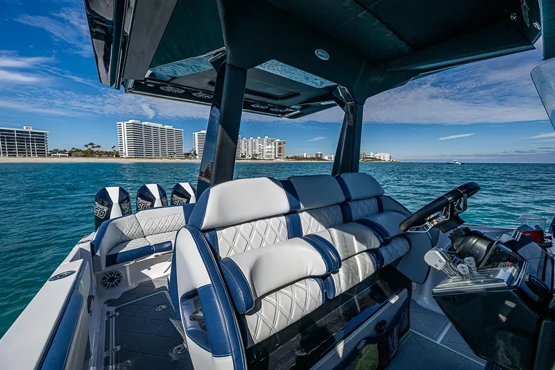  Yacht Photos Pics 2023 Nor-Tech 400 boat interior with luxury seating, ocean view, and modern design.