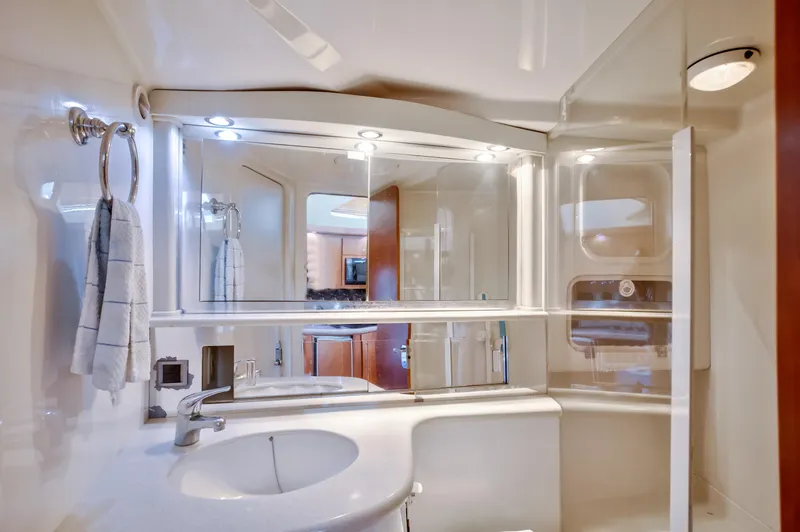  Yacht Photos Pics Luxurious bathroom interior of 2003 Jupiter 35 Flybridge yacht with modern fixtures.
