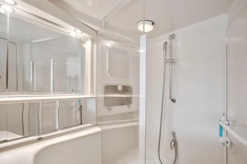  Yacht Photos Pics Luxurious bathroom in 2003 Jupiter 35 Flybridge yacht, featuring sleek design and modern fixtures.