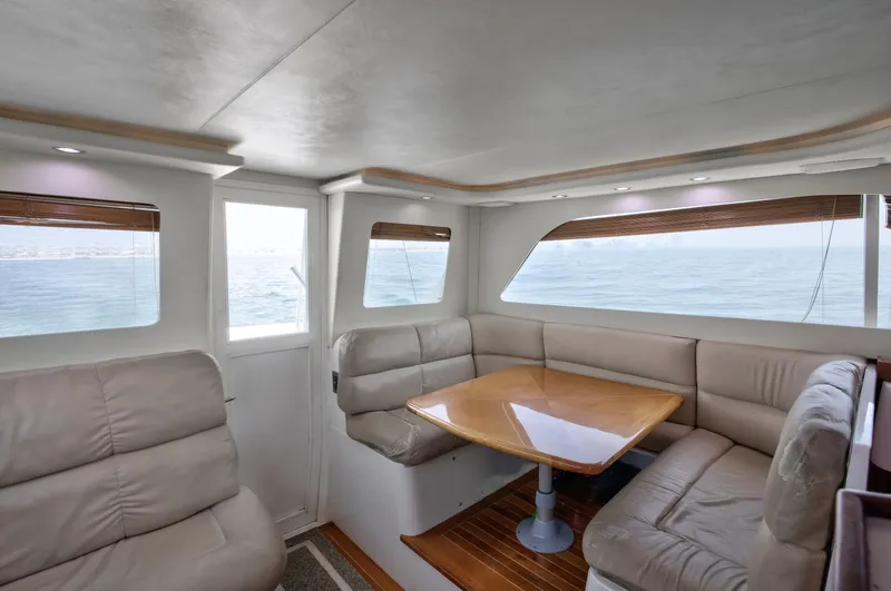  Yacht Photos Pics Luxurious interior of 2003 Jupiter 35 Flybridge yacht with ocean view.