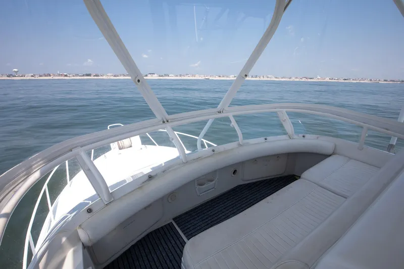  Yacht Photos Pics Jupiter 35 Flybridge 2003 yacht interior with ocean view and white seating.