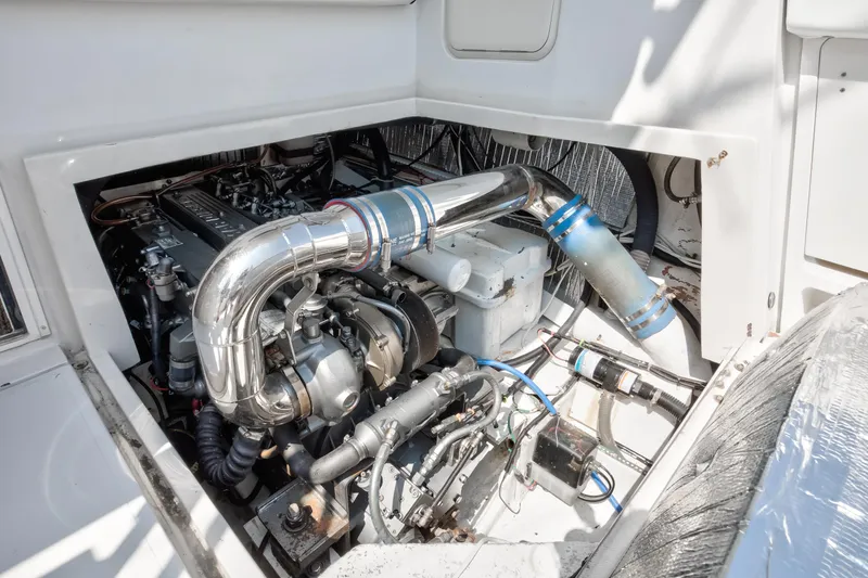  Yacht Photos Pics Engine compartment of 2003 Jupiter 35 Flybridge boat, showcasing mechanical components.