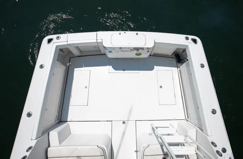  Yacht Photos Pics 2003 Jupiter 35 Flybridge boat deck with seating and storage compartments.