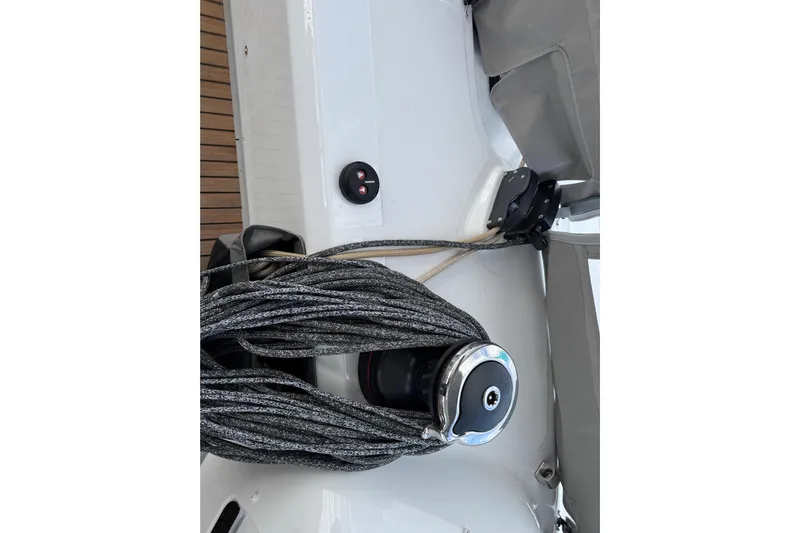  Yacht Photos Pics Close-up of 2026 Lagoon 55 yacht deck with winch and ropes.