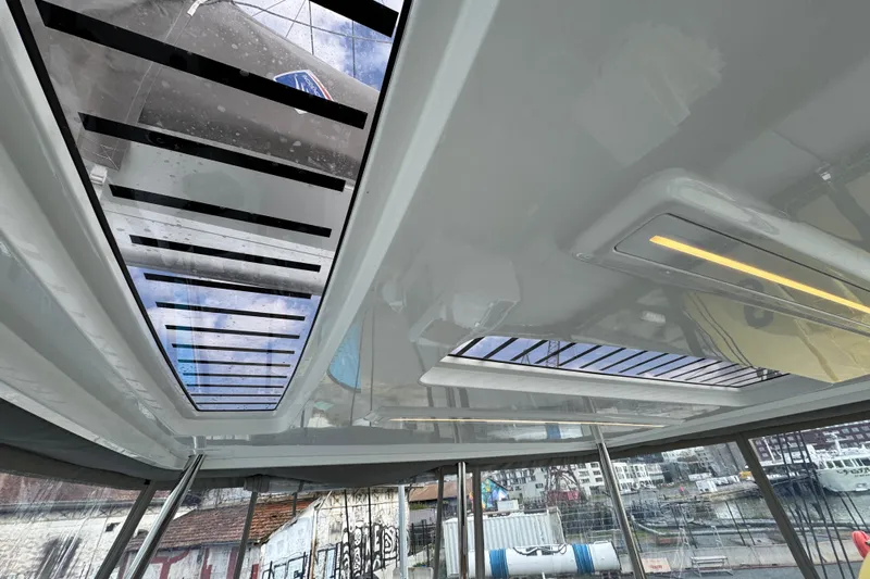 Yacht Photos Pics Interior view of 2026 Lagoon 55 yacht with skylight and modern design.
