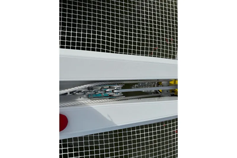  Yacht Photos Pics Close-up of 2026 Lagoon 55 yacht deck with netting and rigging details.
