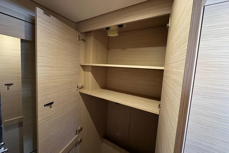  Yacht Photos Pics Spacious wooden cabinet interior on 2026 Lagoon 55 yacht.