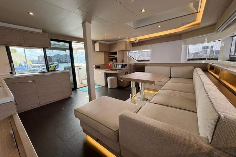  Yacht Photos Pics Luxurious interior of 2026 Lagoon 55 yacht with modern furnishings and ample natural light.