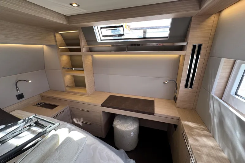  Yacht Photos Pics Luxurious interior of 2026 Lagoon 55 yacht with modern wood finish and ample storage.