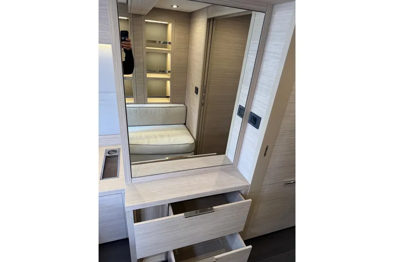  Yacht Photos Pics Interior of 2026 Lagoon 55 yacht with modern wood finish and open drawers.