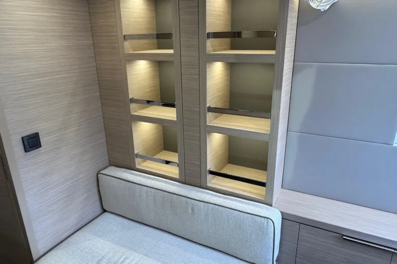  Yacht Photos Pics Interior of 2026 Lagoon 55 yacht with modern shelving and seating.