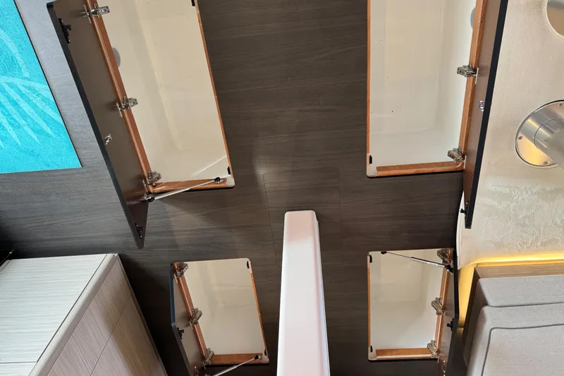  Yacht Photos Pics Interior view of 2026 Lagoon 55 yacht with open storage compartments.