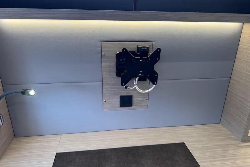  Yacht Photos Pics Wall-mounted TV bracket and light fixture in 2026 Lagoon 55 interior.