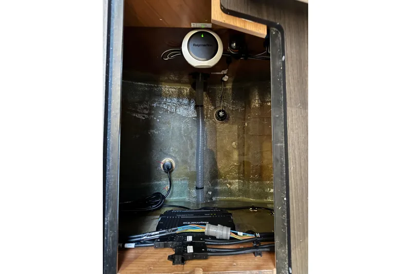  Yacht Photos Pics Interior view of 2026 Lagoon 55 yacht showing electronic equipment and wiring.