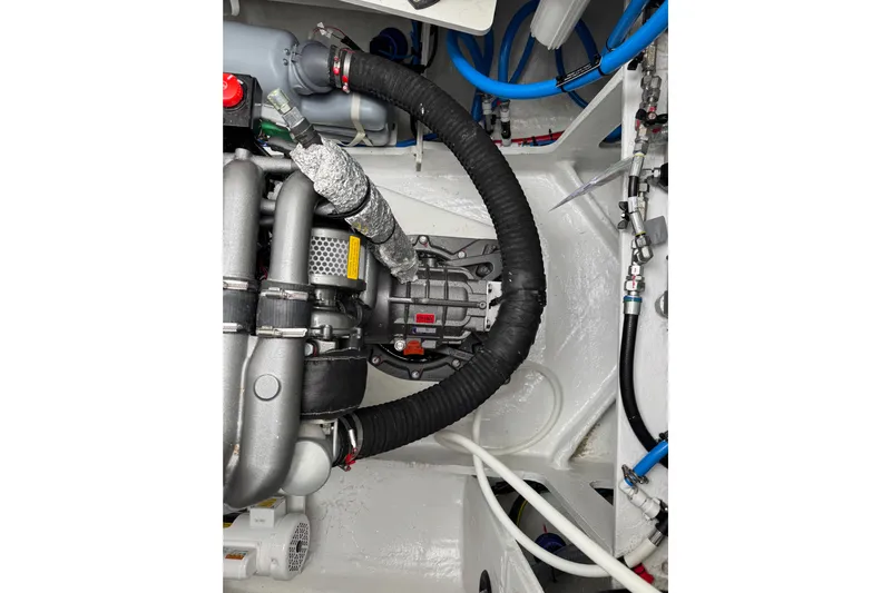  Yacht Photos Pics Engine compartment of a 2026 Lagoon 55 yacht, showcasing intricate mechanical components.