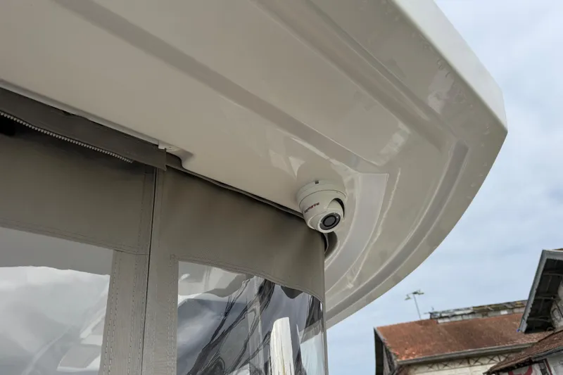  Yacht Photos Pics Security camera on 2026 Lagoon 55 yacht, mounted under white canopy.