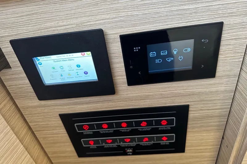  Yacht Photos Pics Control panels on a 2026 Lagoon 55 yacht, featuring digital displays and touch interfaces.