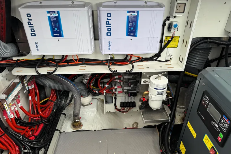  Yacht Photos Pics Electrical system of a 2026 Lagoon 55 yacht, featuring Dolphin Pro chargers and wiring.