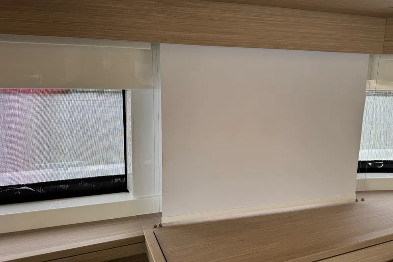  Yacht Photos Pics Interior of 2026 Lagoon 55 yacht with modern window blinds and wooden finish.