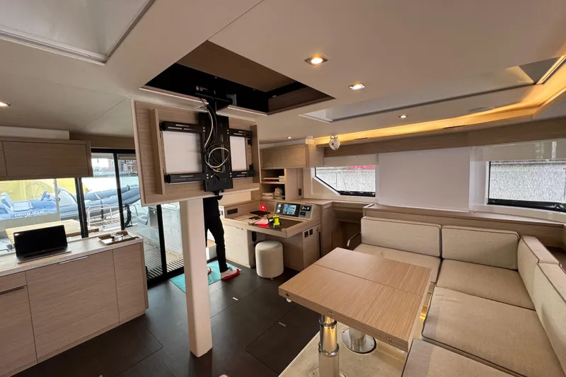  Yacht Photos Pics Luxurious interior of 2026 Lagoon 55 yacht with modern furnishings and advanced navigation equipment.