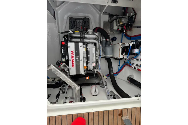  Yacht Photos Pics Engine room of 2026 Lagoon 55 yacht featuring Yanmar engine and modern components.