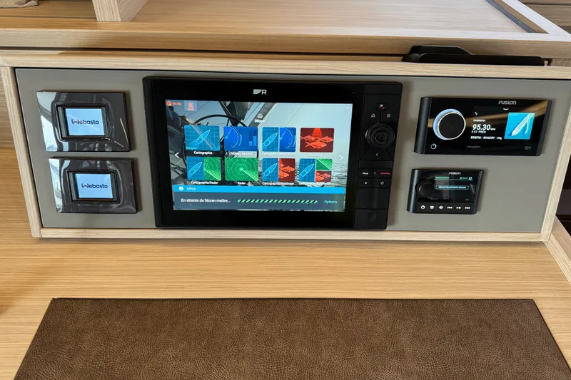  Yacht Photos Pics Control panel of a 2026 Lagoon 55 yacht with navigation and audio systems.