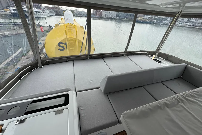  Yacht Photos Pics 2026 Lagoon 55 yacht interior with spacious seating and waterfront view.