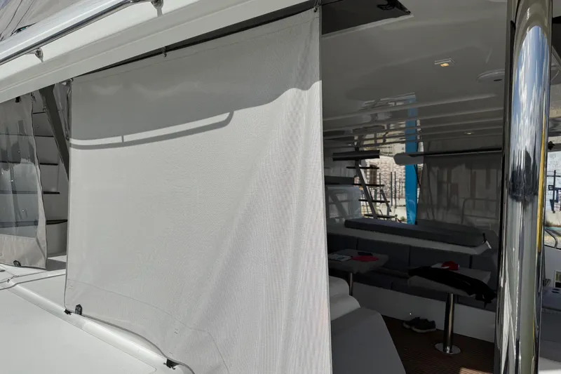  Yacht Photos Pics 2026 Lagoon 55 yacht interior with modern seating and sleek design elements.