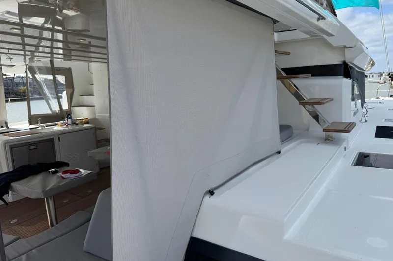  Yacht Photos Pics Modern Lagoon 55 yacht interior with sleek design and wooden stairs, 2026 model.