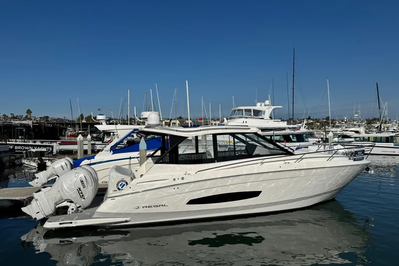 36 Xo Yacht Photos Pics 2026 Regal 36 XO yacht docked at marina, featuring sleek design and Yamaha outboard engines.