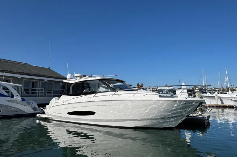 36 Xo Yacht Photos Pics 2026 Regal 36 XO yacht docked at marina under clear blue sky.