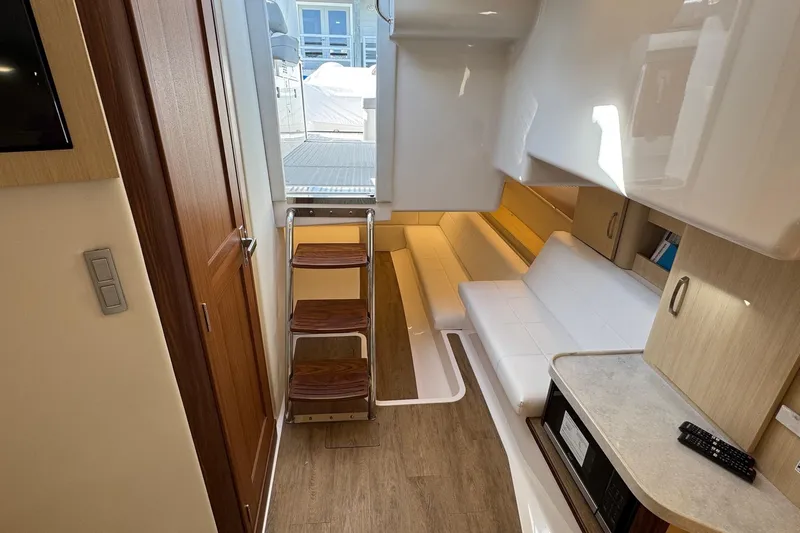 36 Xo Yacht Photos Pics Luxurious interior of 2026 Regal 36 XO yacht with modern seating and wooden accents.