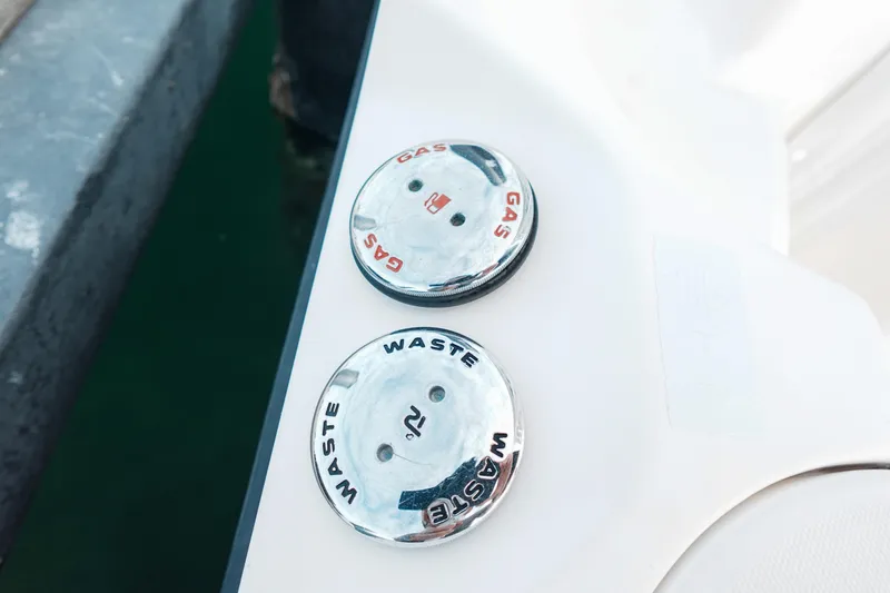  Yacht Photos Pics 2007 Boston Whaler 305 Conquest gas and waste caps on boat deck.
