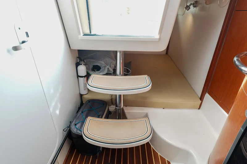  Yacht Photos Pics Interior of 2007 Boston Whaler 305 Conquest with steps and storage area.