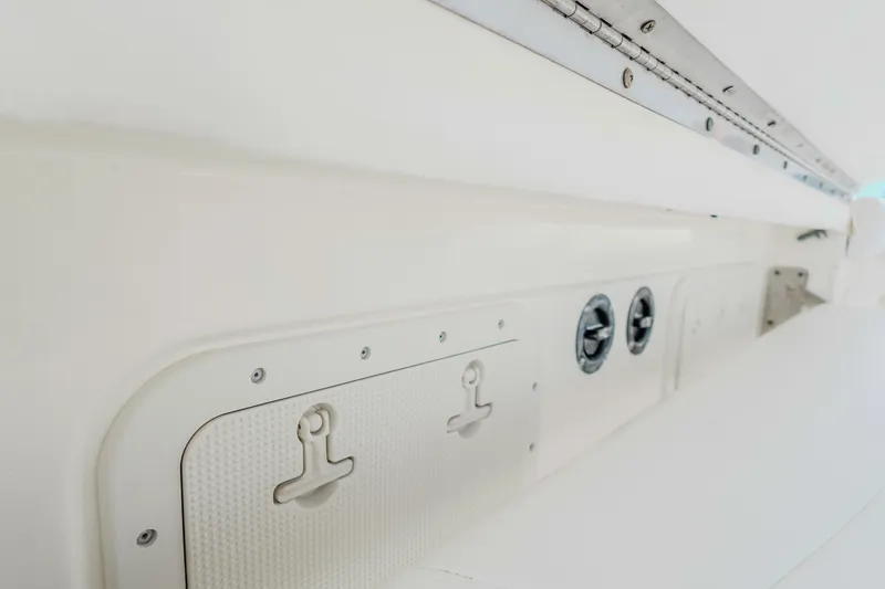  Yacht Photos Pics 2007 Boston Whaler 305 Conquest interior detail, featuring storage compartments and fixtures.