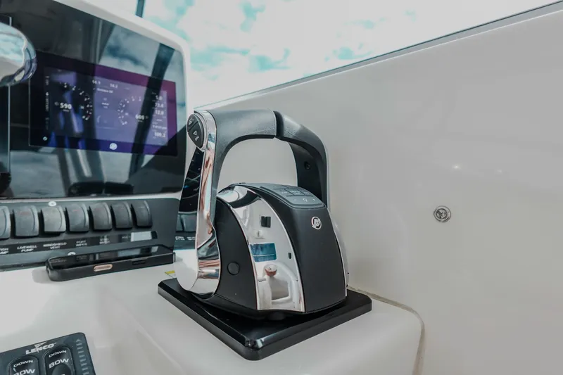  Yacht Photos Pics Control panel of 2007 Boston Whaler 305 Conquest boat, featuring modern throttle and display.