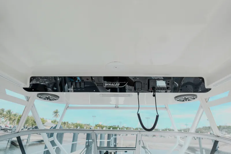  Yacht Photos Pics 2007 Boston Whaler 305 Conquest boat interior with control panel and communication equipment.