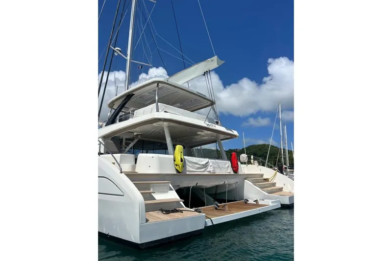 Maty Yacht Photos Pics 2023 Lagoon Seventy 7 yacht docked, showcasing elegant design and spacious deck.