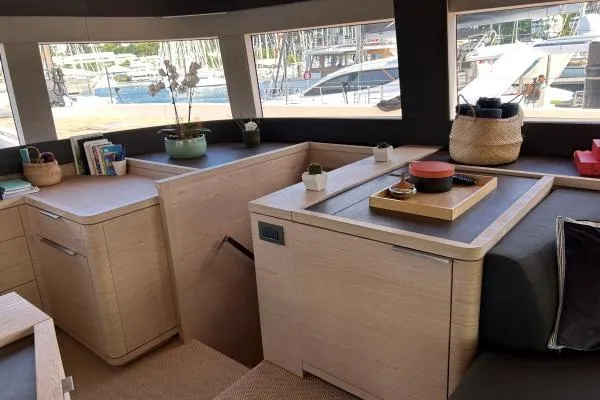 Maty Yacht Photos Pics Luxurious interior of 2023 Lagoon Seventy 7 yacht with modern decor and ample natural light.