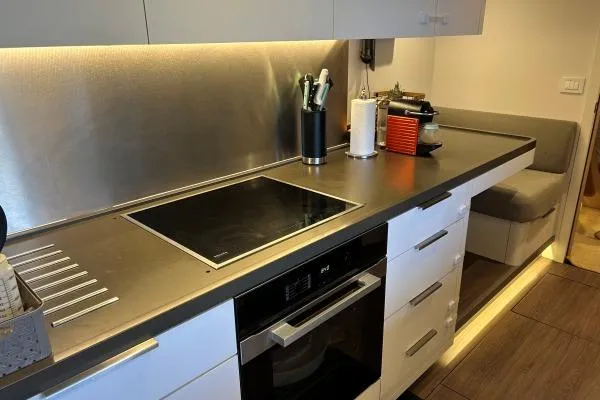 Maty Yacht Photos Pics Modern kitchen in 2023 Lagoon Seventy 7 yacht with sleek countertops and appliances.
