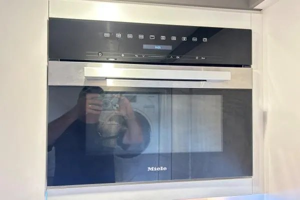 Maty Yacht Photos Pics Modern Miele oven in Lagoon Seventy 7 yacht, 2023 model, with sleek design and digital controls.