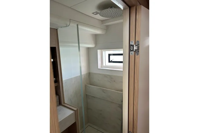 Maty Yacht Photos Pics Luxurious bathroom interior of 2023 Lagoon Seventy 7 yacht with modern shower design.