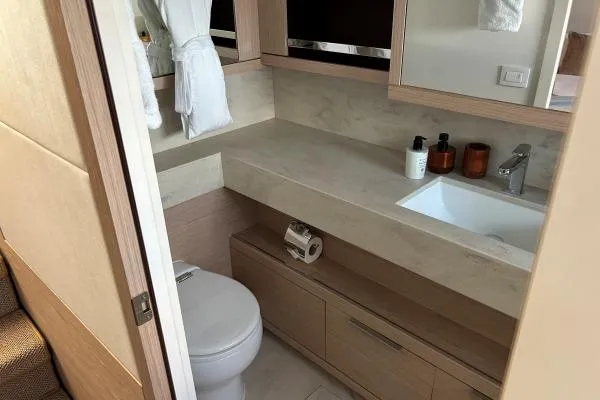 Maty Yacht Photos Pics Luxurious bathroom in 2023 Lagoon Seventy 7 yacht with modern fixtures and elegant design.