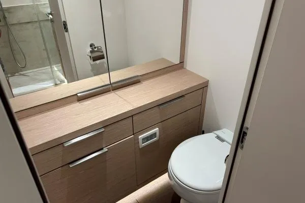 Maty Yacht Photos Pics Modern bathroom in 2023 Lagoon Seventy 7 yacht with sleek vanity and shower.