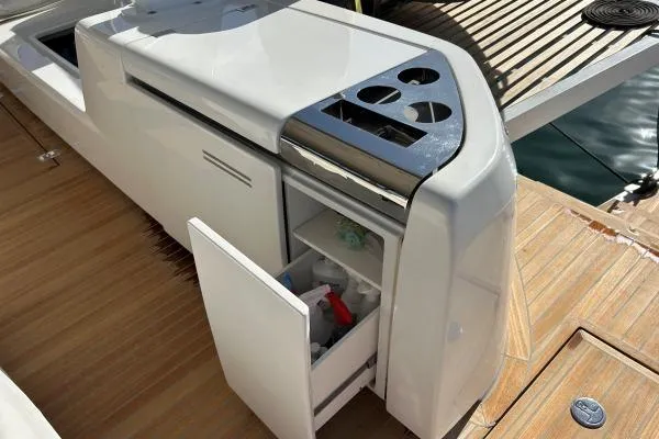 Maty Yacht Photos Pics Outdoor kitchen on 2023 Lagoon Seventy 7 yacht with open storage and grill.