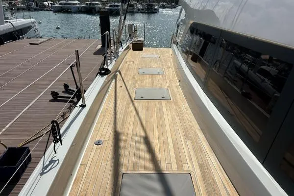 Maty Yacht Photos Pics 2023 Lagoon Seventy 7 yacht deck with wooden finish at marina.