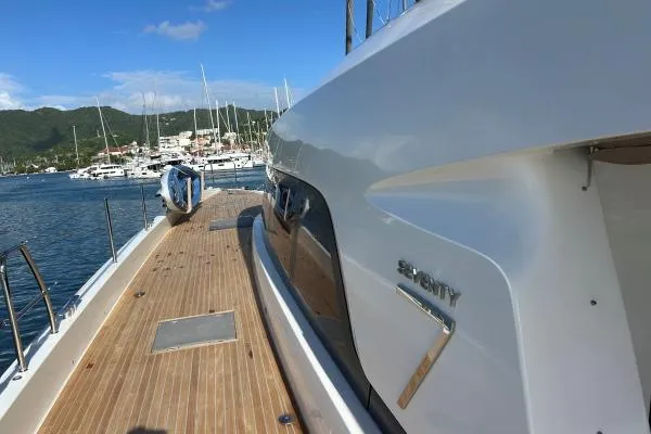 Maty Yacht Photos Pics 2023 Lagoon Seventy 7 yacht docked at a marina, showcasing sleek design and luxury.