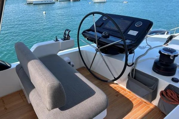 Maty Yacht Photos Pics Helm of 2023 Lagoon Seventy 7 yacht with modern controls and ocean view.